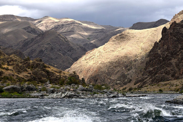 Hell’s Canyon in Idaho with Snake River rapids and steep canyon walls for rafting and hiking