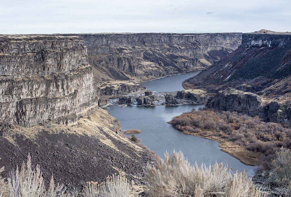 Snake River Canyon in Twin Falls Idaho with layered canyon walls and river winding through the landscape