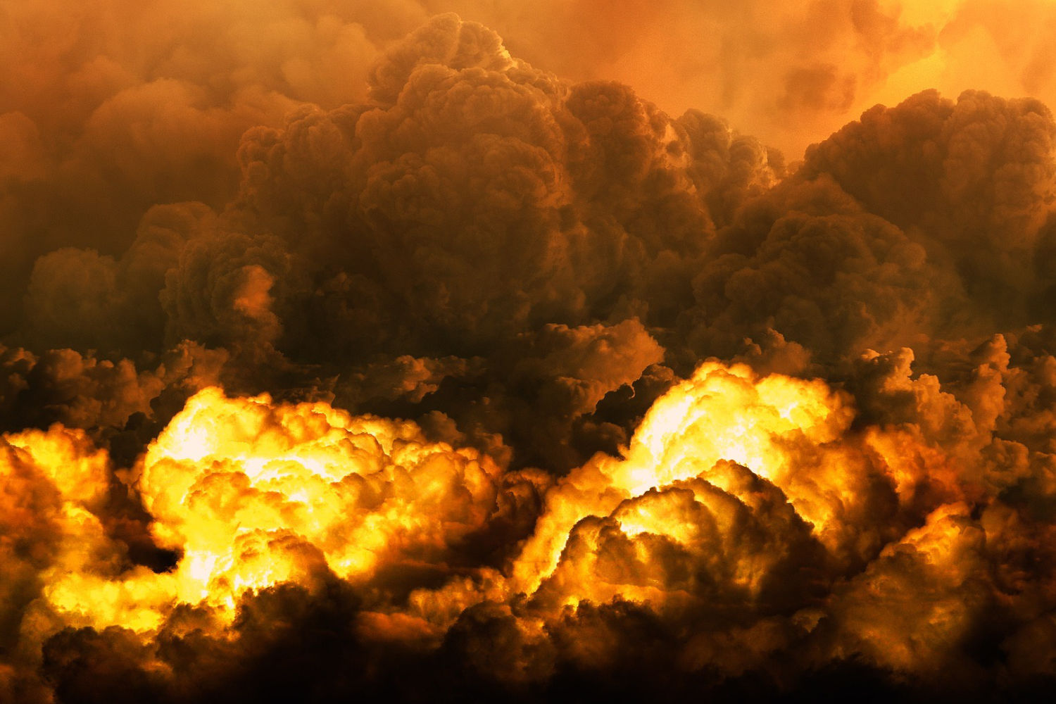 Massive glowing fire clouds and dense smoke rising through a dark apocalyptic sky resembling a large explosion or volcanic event