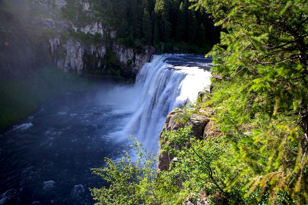 Upper Mesa Falls in eastern Idaho with waterfall cascading over volcanic rock along the Snake River