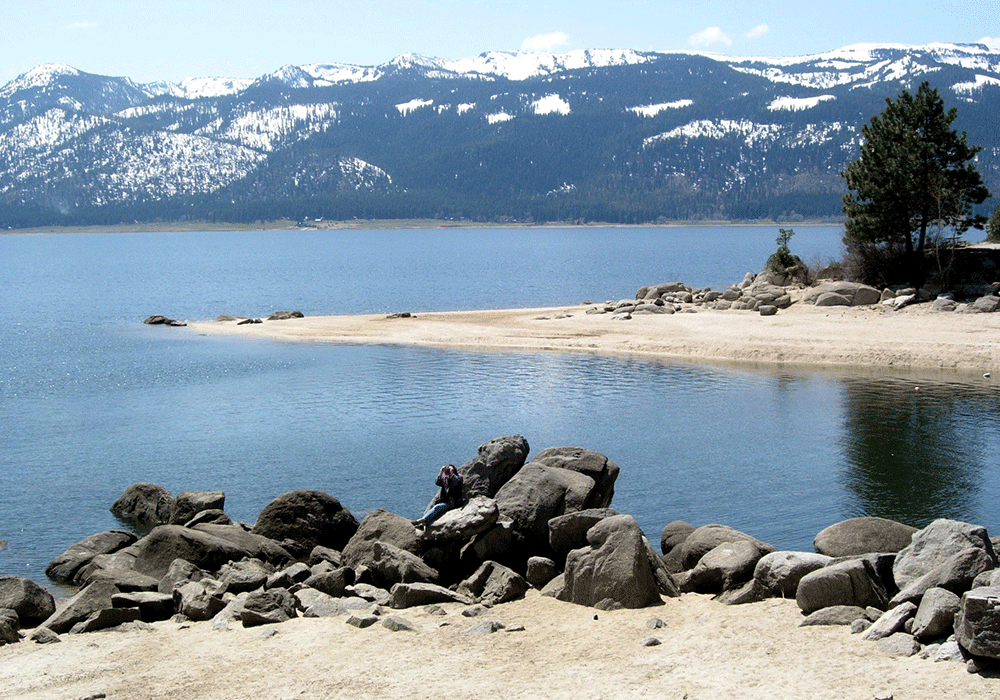 Lake Cascade in Idaho with rocky shoreline, calm water, and mountains in the background