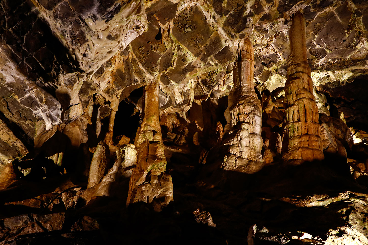Minnetonka Cave in Idaho with illuminated stalactites and underground rock formations during guided cave tour