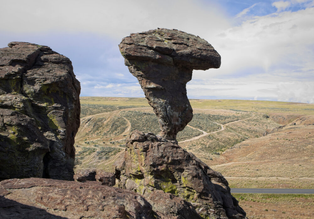 Balanced Rock in Southern Idaho, a natural erosion-formed rock formation rising from the high desert landscape and a popular roadside stop on Southern Idaho road trips.
