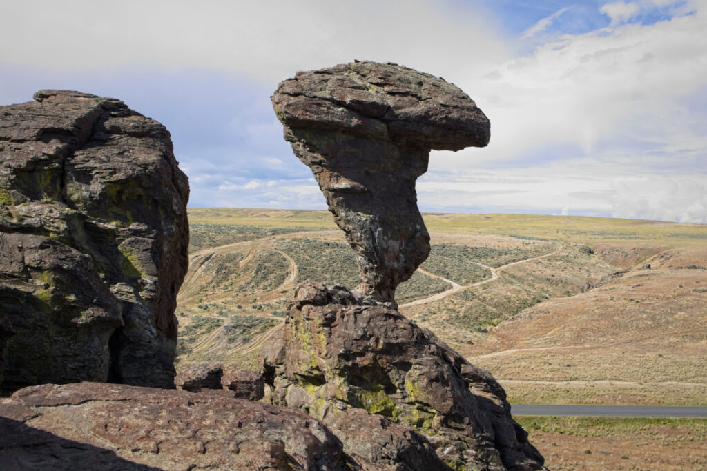 Balanced Rock in Southern Idaho, a natural erosion-formed rock formation rising from the high desert landscape and a popular roadside stop on Southern Idaho road trips.