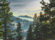 Scenic mountain landscape in southern Idaho with forested hills, morning light, and layered terrain