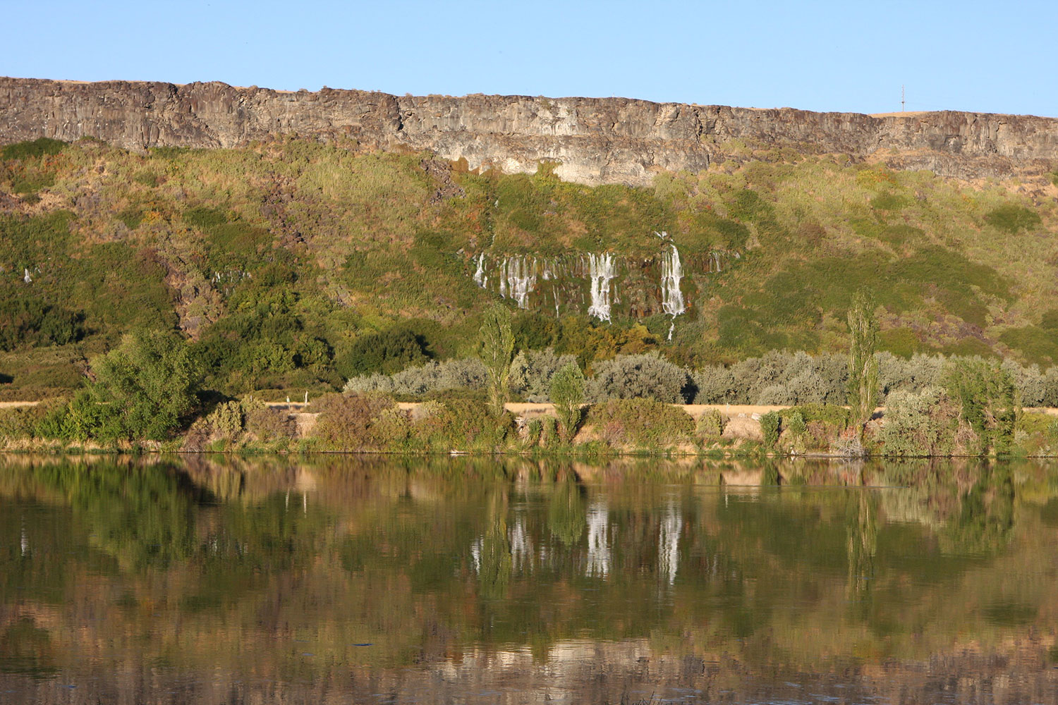 Thousand Springs State Park in southern Idaho with waterfalls flowing from canyon walls into the Snake River