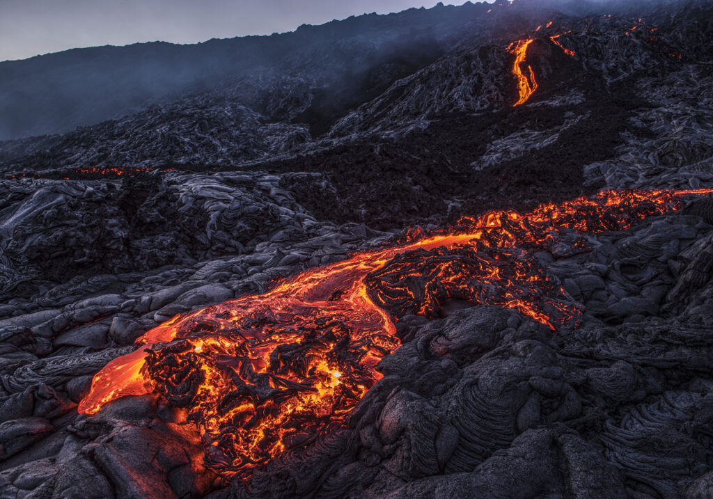 Molten lava flow illustrating how volcanic eruptions create lava tube caves like Idaho’s Mammoth Cave