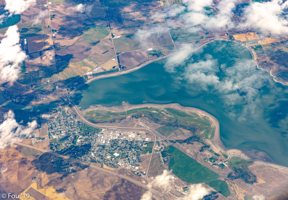 aerial view of American Falls Reservoir in Idaho with shoreline, surrounding farmland, and nearby town