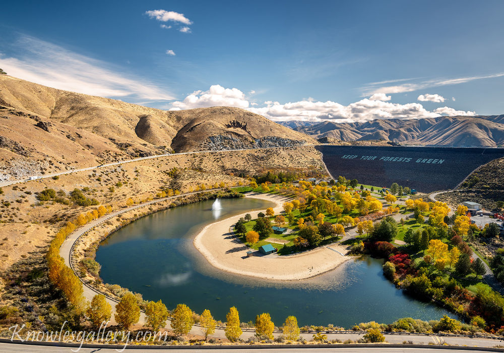 aerial view of Lucky Peak Dam and reservoir near Boise Idaho with river, park, and surrounding hills