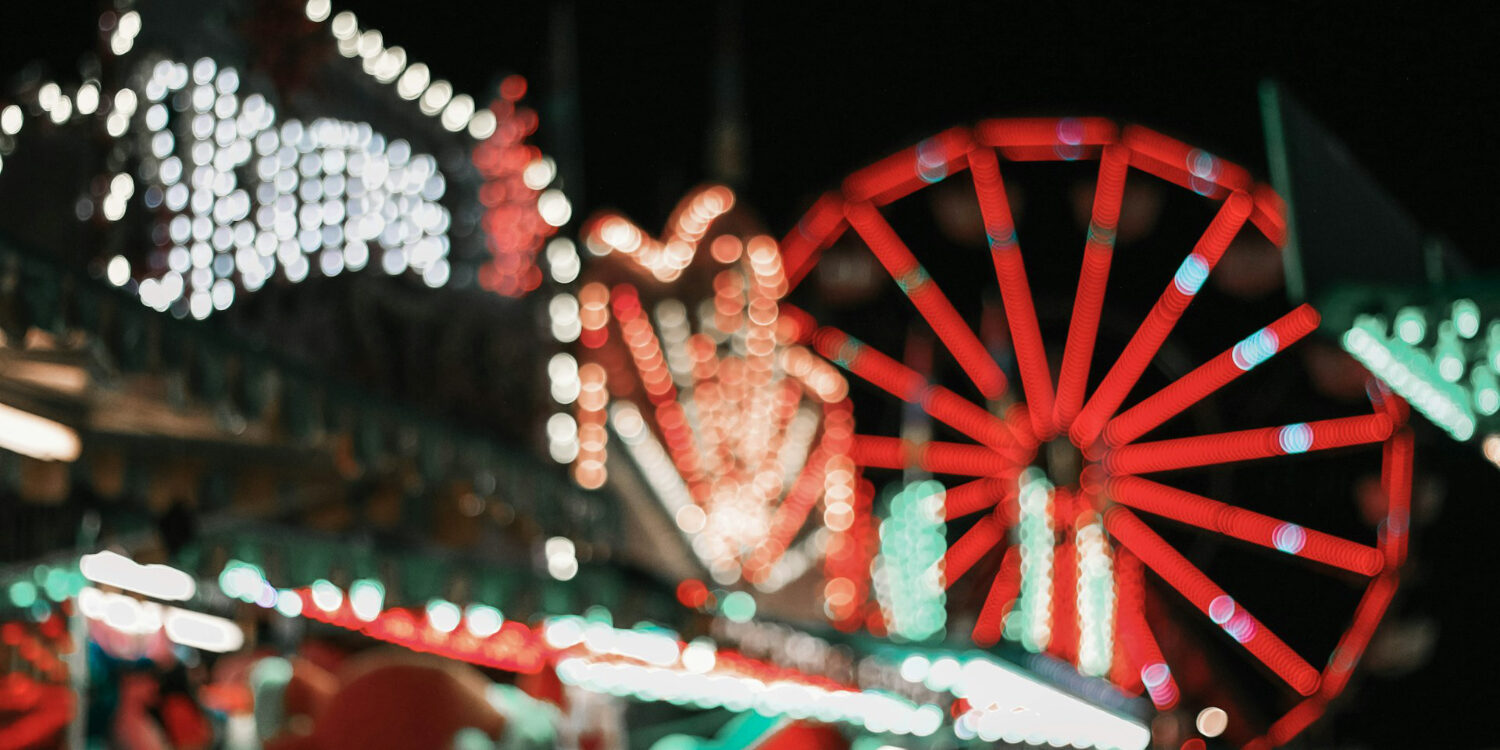 Carnival rides lit up at night at the Magic Valley Fair and Rodeo in Idaho, showing the lively fair atmosphere visitors can expect