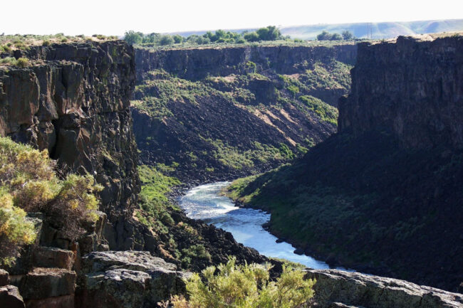 Malad Gorge State Park in Idaho featuring a deep canyon with the Snake River flowing through rugged cliffs