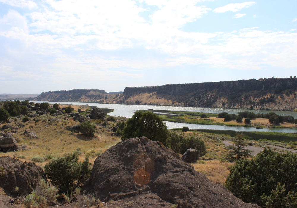View of Snake River flowing through canyon landscape at Massacre Rocks State Park