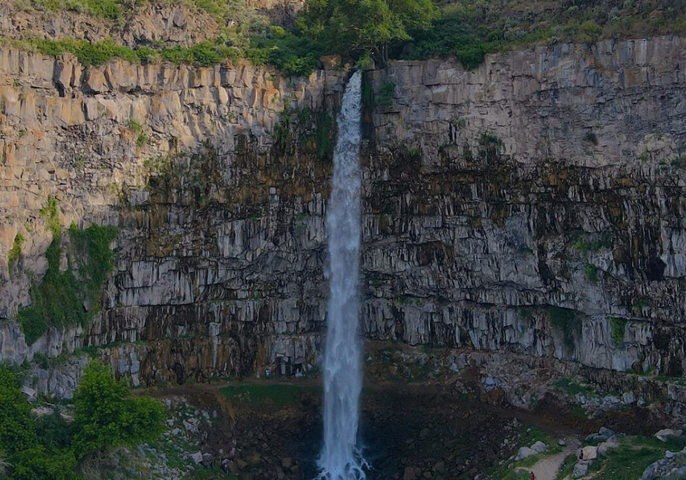 Perrine Coulee Falls cascading down rock canyon wall in Twin Falls Idaho