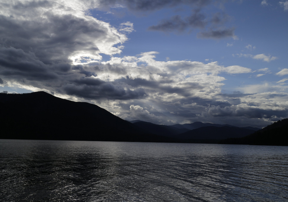 Scenic view of Priest Lake in Idaho with mountains and dramatic clouds over the water