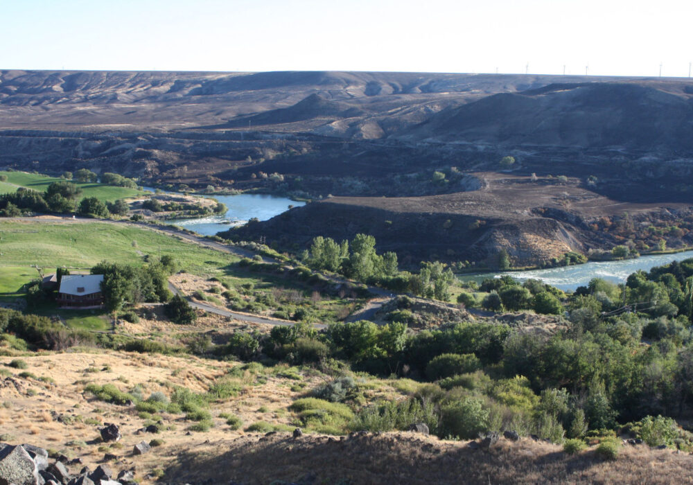 Scenic view of the Snake River winding through farmland and rolling hills near Malad Gorge State Park in Idaho