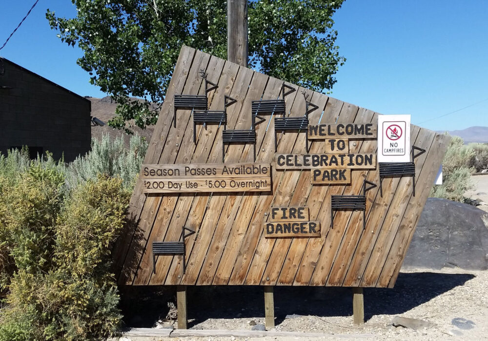 celebration-park-melba-idaho Welcome sign at Celebration Park near Melba, Idaho featuring petroglyph-inspired artwork and desert surroundings near the Snake River Canyon